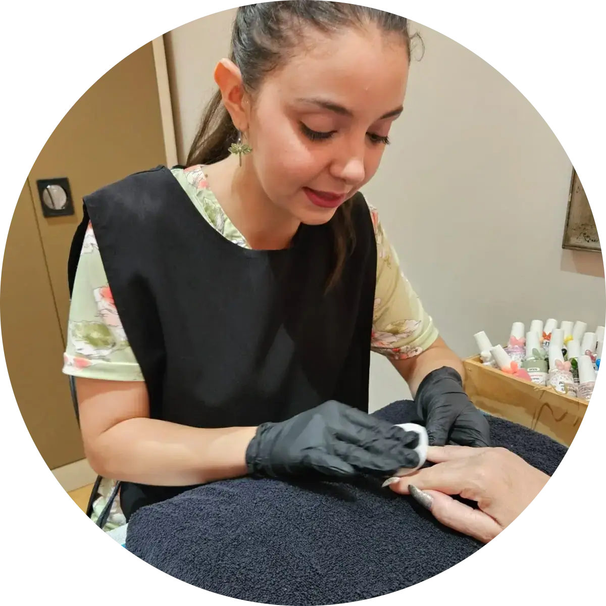 Bianca from La oliva beauty salon in Brackenfell, prepping her client's nails for nail polish