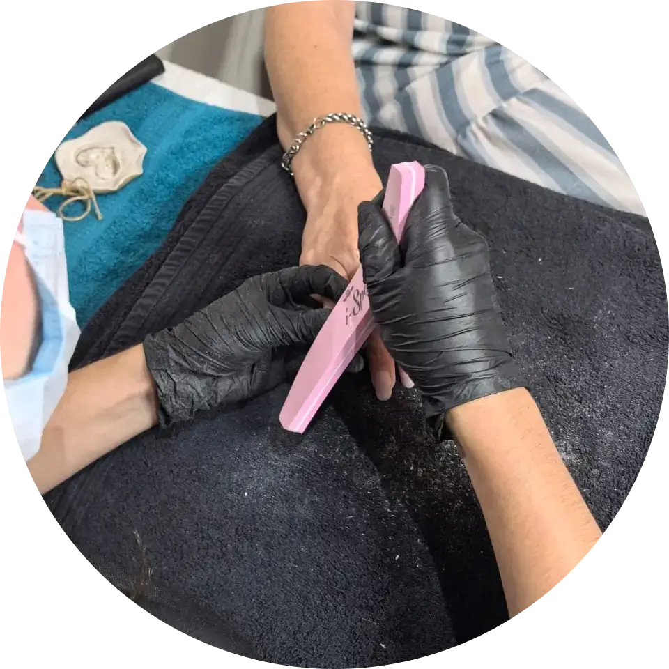 Bianca from La oliva beauty salon in Brackenfell, filling a client's nails