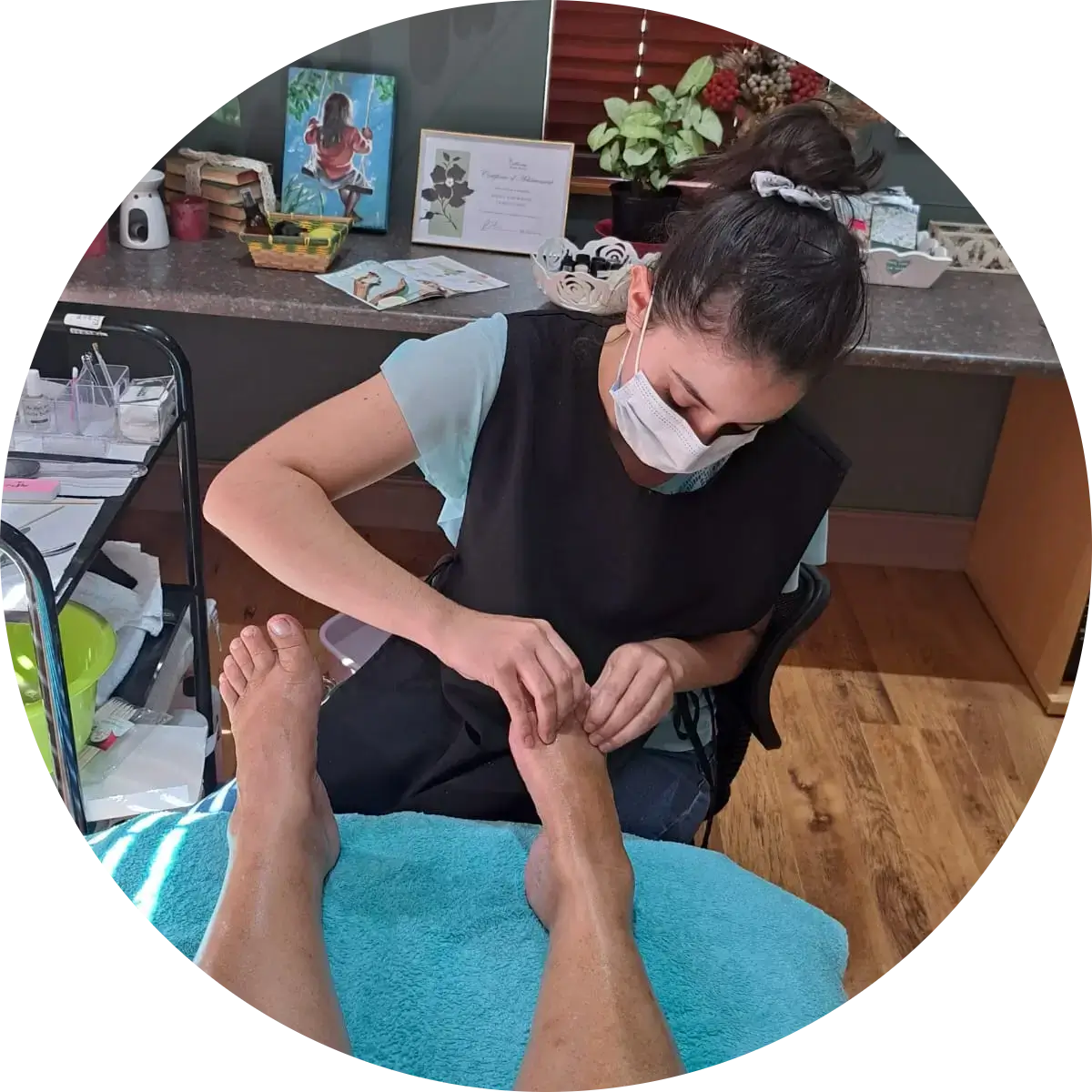 Bianca from La oliva beauty salon in Brackenfell, massaging a client's feet, after a pedicure.